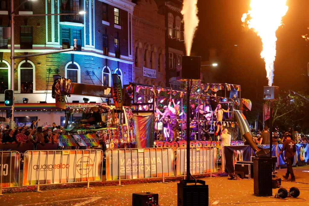 Parade float with bright lights and fire effects