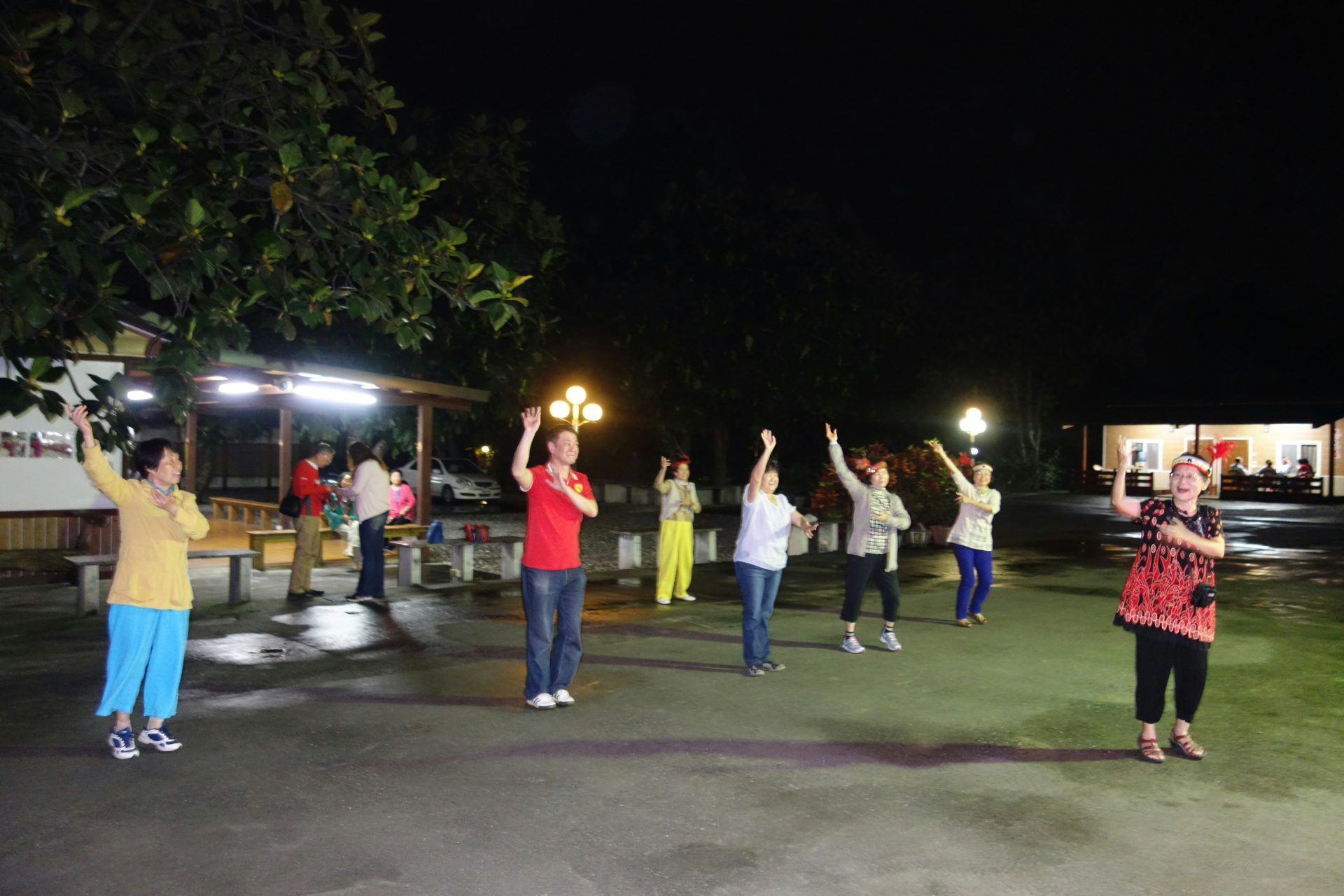People exercising outdoors at night